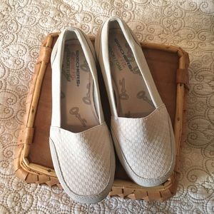 Skechers cream slip ons